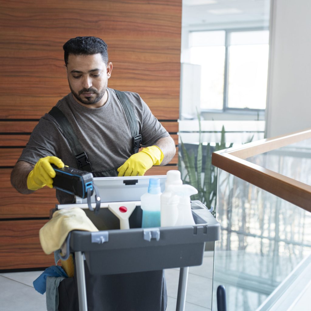 medium-shot-man-walking-with-cleaning-cart